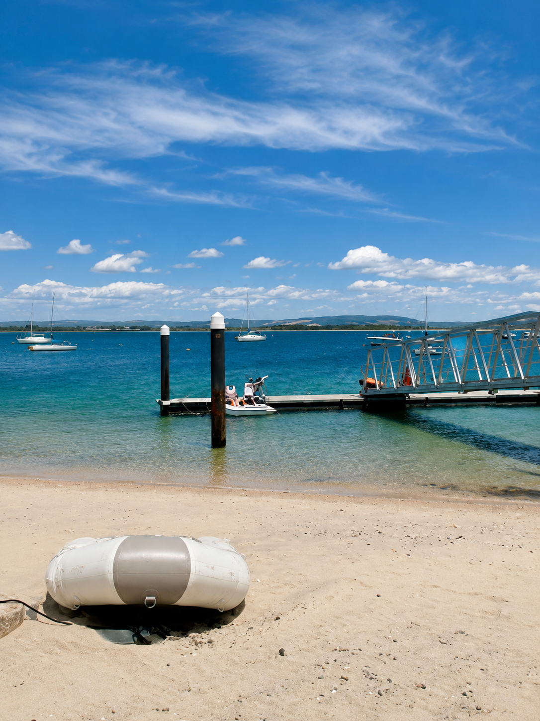 Sandy beach and jetty on Chichester Harbour